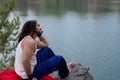 Young Man sitting alone outdoor Travel Lifestyle concept with la Royalty Free Stock Photo