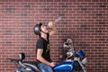 Young man sitting on a bike drinking alcohol Royalty Free Stock Photo