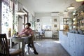 Young man sitting in coffee shop. Royalty Free Stock Photo