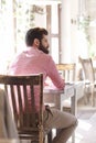 Young man sitting in coffee shop. Royalty Free Stock Photo