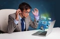 Young man sitting at desk and watching his photo gallery on laptop Royalty Free Stock Photo