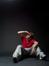 Young man sitting on the floor Royalty Free Stock Photo