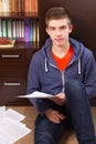 Young man sitting on the floor Royalty Free Stock Photo