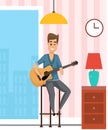 Young man sitting on high chair playing acoustic guitar, musician guitarist at home sing songs Royalty Free Stock Photo