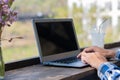 A young man sitting at his desk with his laptop typing keyboard enjoys surfing the internet and looking for ideas for working in a Royalty Free Stock Photo