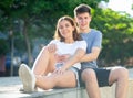 Young man is sitting with his girlfriend Royalty Free Stock Photo