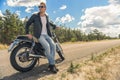 Young man sitting on his motorbike Royalty Free Stock Photo