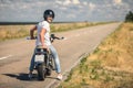 Young man sitting on his motorbike Royalty Free Stock Photo