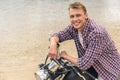 Young man sitting on his motorbike Royalty Free Stock Photo