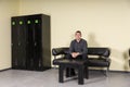 Young Man Sitting on Leather Sofa Locker Room Royalty Free Stock Photo