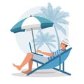 Young man sitting in lounge deck chair at the beach working and relaxing Royalty Free Stock Photo