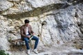 Young man sitting in nature park Royalty Free Stock Photo