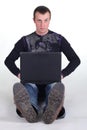 Young man sitting with notebook