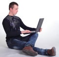 Young man sitting with notebook