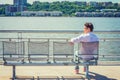 Young man sitting outdoors, waiting in New York City Royalty Free Stock Photo