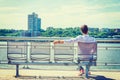 Young Man sitting outdoors, waiting in New York City Royalty Free Stock Photo