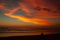 Young man sitting outdoors watching the sunset. Thinking and relaxing concept, Australia Royalty Free Stock Photo