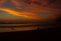 Young man sitting outdoors watching the sunset. Thinking and relaxing concept, Australia Royalty Free Stock Photo