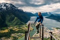 Young man is sitting on rampestreken in Norway Royalty Free Stock Photo