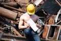 Bodybuilder Flexing Muscles Outdoors in Industrial Junk Yard Royalty Free Stock Photo