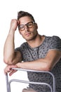 Young man sitting, wearing glasses Royalty Free Stock Photo