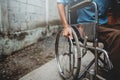 Young man sitting on wheelchair, Disabled concept outdoor. Royalty Free Stock Photo