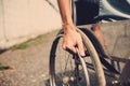 Young man sitting on wheelchair, Disabled concept outdoor. Royalty Free Stock Photo