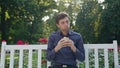 Young Man Having a Snack in the Park Royalty Free Stock Photo