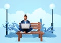 Young man sitting on wooden bench in the park while working with laptop Royalty Free Stock Photo