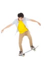 Young man Skateboard to jump isolated on white Royalty Free Stock Photo