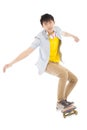 Young man Skateboard to jump isolated on white background Royalty Free Stock Photo