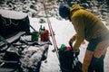 Young man with ski in the snow forest