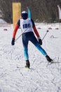 Young man skier running downhill in powder snow, Alpine mountains. Winter sport and recreation, leisure outdoor activities