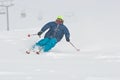 Young man skiing in snowstorm Royalty Free Stock Photo