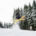 Young man on skis doing tricks at ski resort. Royalty Free Stock Photo