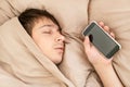 Young Man sleep with a Phone Royalty Free Stock Photo