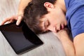 Young man sleep with a tablet Royalty Free Stock Photo