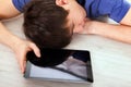 Young Man sleep with a Tablet Royalty Free Stock Photo