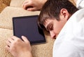 Young Man sleep with a Tablet Royalty Free Stock Photo