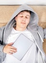 Young Man sleep with a Tablet Royalty Free Stock Photo