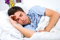 Young man sleeping in bed Royalty Free Stock Photo