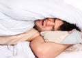 Young man sleeping in bed Royalty Free Stock Photo
