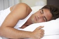 Young Man Sleeping On Bed Royalty Free Stock Photo