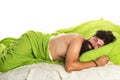 Young man sleeping in bed with pillows at home. Handsome man in bed. sleeper. Wake up Sleepy. Royalty Free Stock Photo