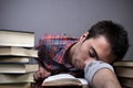 Young man sleeping on books Royalty Free Stock Photo