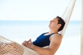 Young man sleeping in a hammock at the beach Royalty Free Stock Photo