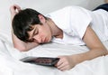 Young Man Sleeps with Tablet Royalty Free Stock Photo