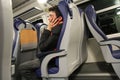 Young man slepping on the train. Royalty Free Stock Photo