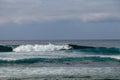 Young man sliding down a wave on a yellow surfboard. Surfer on a yellow surfboard on the crest of the wave. Young surfer learns to Royalty Free Stock Photo