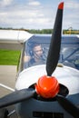 Young man in small plane cockpit outdoors Royalty Free Stock Photo